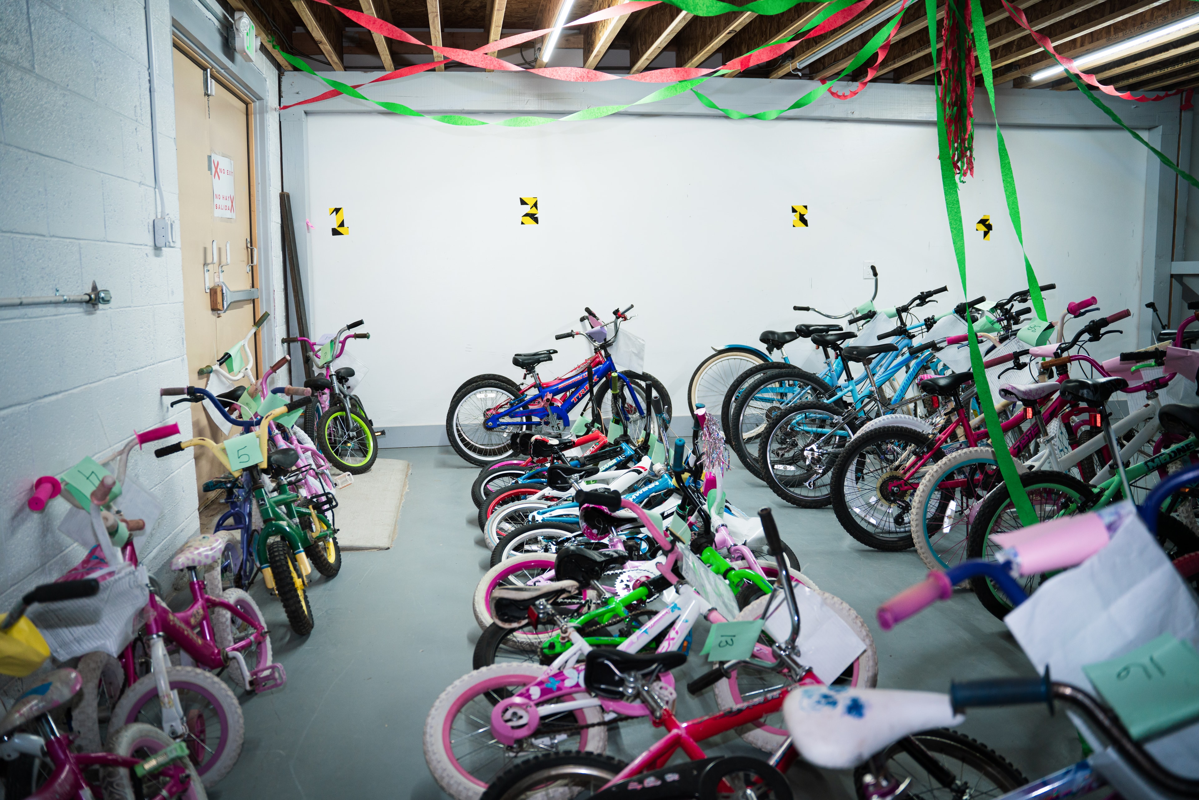 Bikes, including many for children, lined up inside the Chainbreaker headquarters