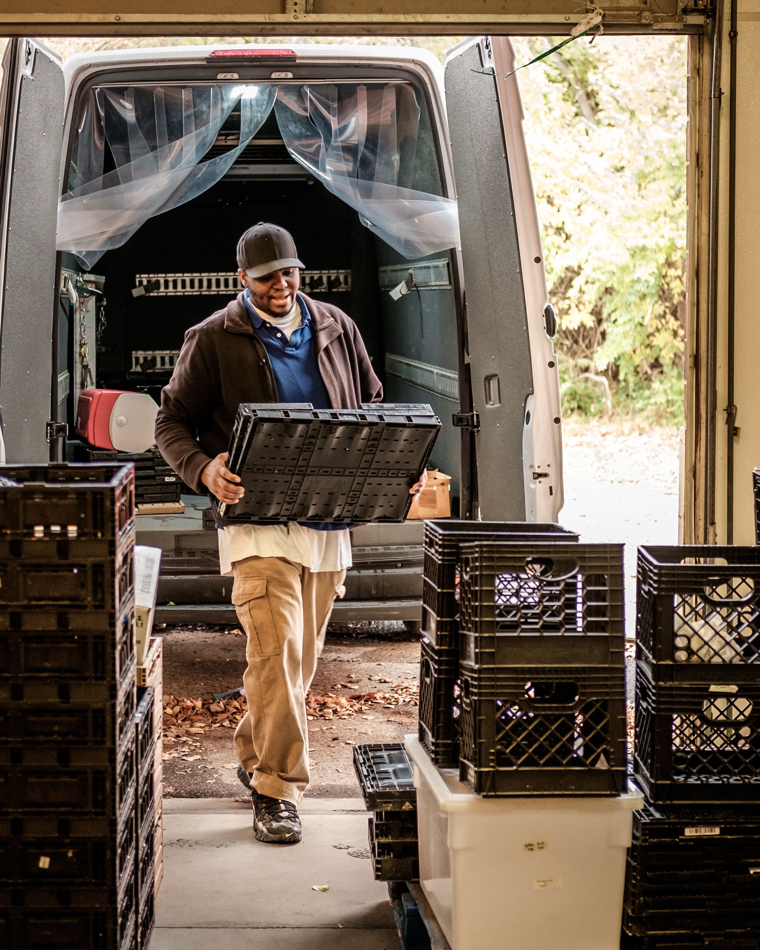 Zeke Coleman unloads a van at Our Harvest